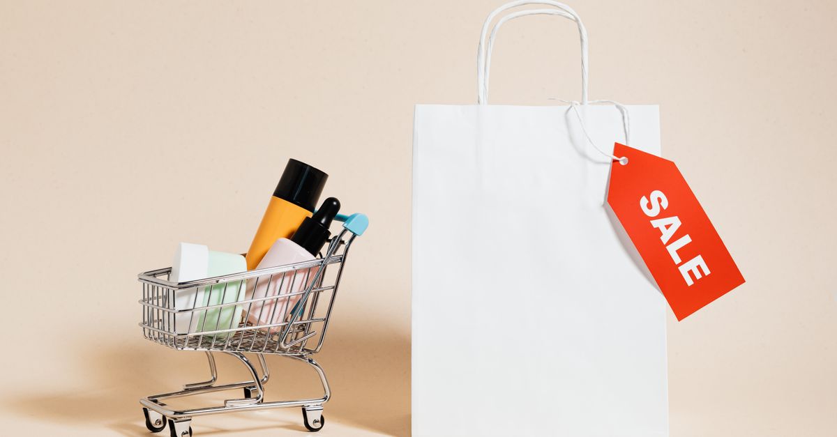 Minimalist image featuring a shopping cart with products and a sale-tagged bag.